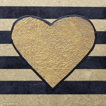 golden heart on striped backgroundの写真素材