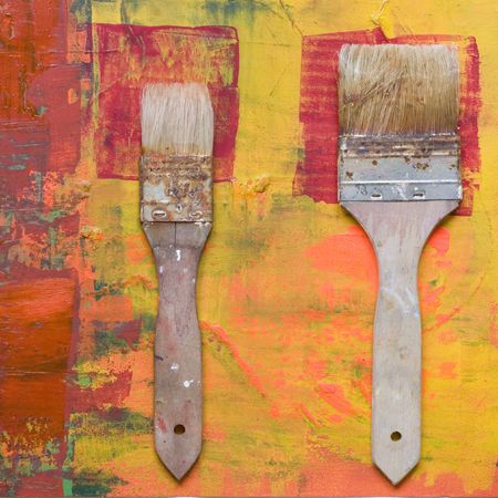 old used paintbrush on abstract artworkの写真素材