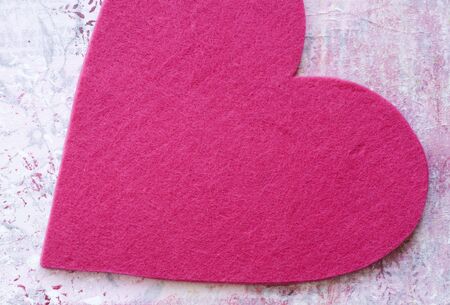 felt heart on painted background, artwork is created and painted by myselfの写真素材