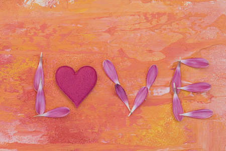 word love made with pink petal and heartの写真素材
