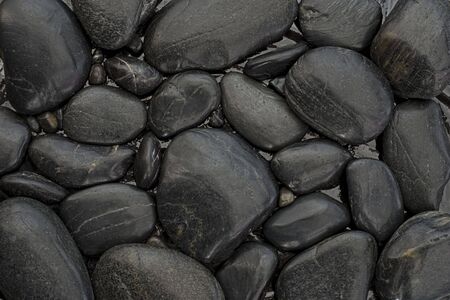 background of many black pebbleの写真素材