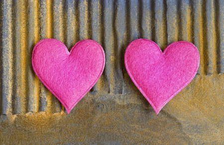 pink heart on rusty surfaceの写真素材