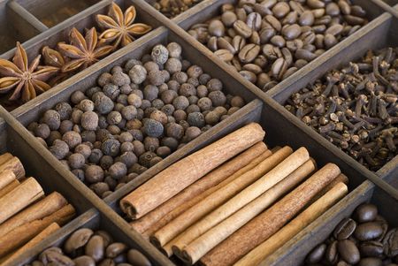 assortment of spices in a wooden boxの写真素材