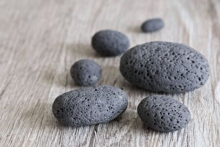 gray pebble on wooden background