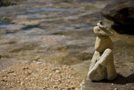 tower build of gray pebble on beachの写真素材