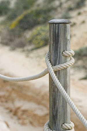 part of dock railing at the beachの写真素材