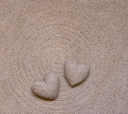 sand hearts on circle backgroundの写真素材