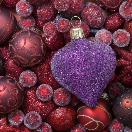 shimmering festive christmas decoration in red and purpleの写真素材