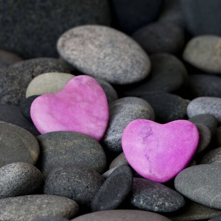 pink stone hearts and gray pebbleの写真素材