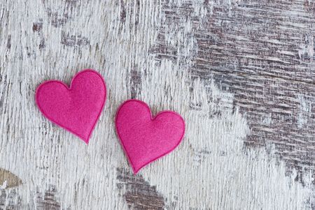two pink hearts on old driftwoodの写真素材