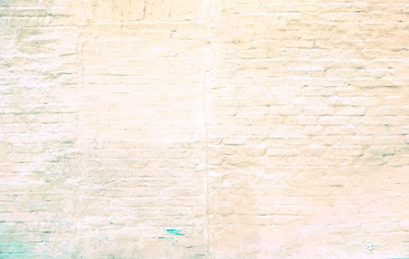 Clear white ivory big brick wall with paint on it and peeps brick texture with horizontal and...