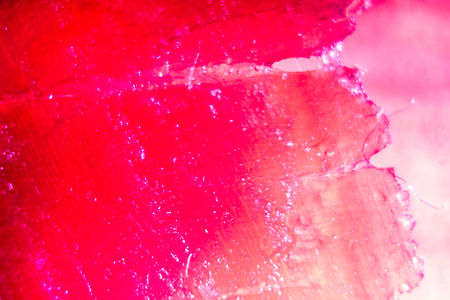 small lines and spots on burgundy bloody red waves of texture of spanish ham, jamon meat texture as abstract background, lines of ham meat texture, abstract texture of parallel long linesの写真素材