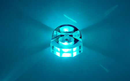 Circle big chandelier with crystals, round mirror and lamps which made reflection on ceiling as star light. Beautiful luxury chandelier with brilliants and light insideの写真素材