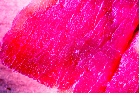 bloody red coral waves of texture of spanish ham, jamon meat texture as abstract background, lines of ham meat texture, abstract texture of parallel long lines nature colorの写真素材