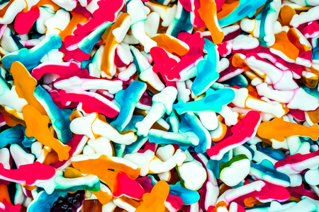 colordul jelly whale candies as background. many sweet jelly fish as best dessert for kids and adults. jelly whales as textureの写真素材