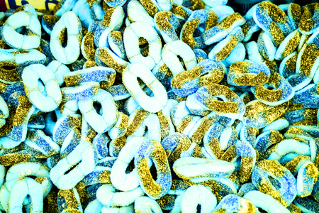 sweet candy background. chaotic sweet colorful jelly ovals and circles in sugar. jelly circles breaded in sugar. natural jelly candy as present and dessert for childrenの写真素材