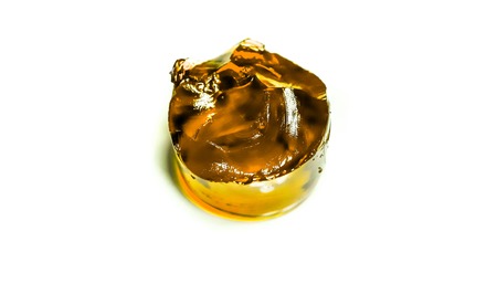 big round peace of berry jelly against white background side top view. Homemade Gelatin jelly...