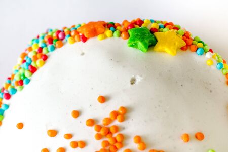 colorful decorative ugar balls drops and stars at cakeの写真素材