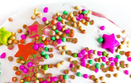 colorful decoration on white top cakeの写真素材