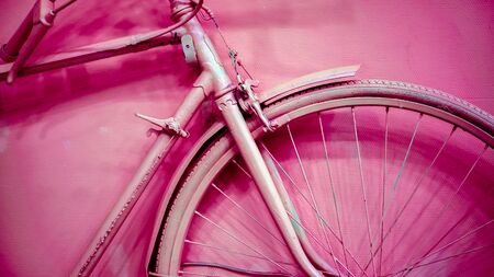 vintage bicycle on decorative color wallの写真素材