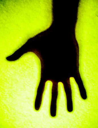 Shadow hands of the Man behind frosted glass.の写真素材