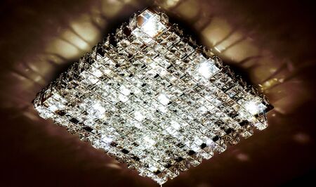 big square chandelier with many crystals and working lampsの写真素材