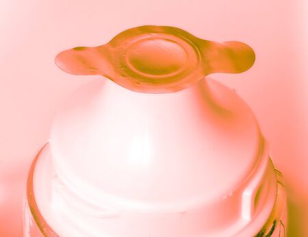 coral orange light on new paste tube with closedの写真素材