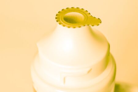 top parte of new tube for paste or cream with closed thingの写真素材