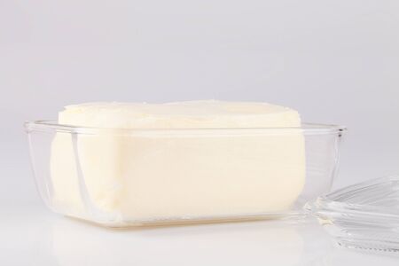 Butter on a white surface. Butter isolated on a white background.の写真素材