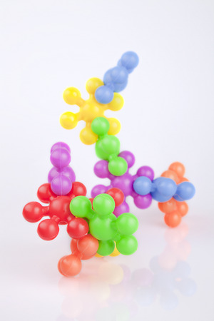 Colorful meccano plastic toys on a white surface. Meccanos isolated on white background.の写真素材