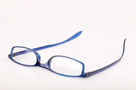 Eye glasses on a white surface. Reading glasses isolated on white background.