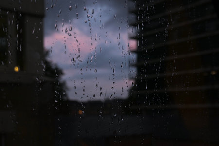 A rainy day and purple sky in the evening of Bristol, United Kingdom. Emotional water-drops.の写真素材