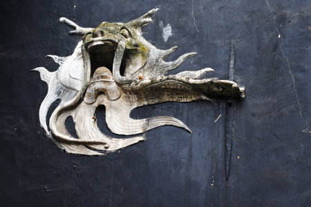 dragon sculpture at building wall in Chinaの写真素材
