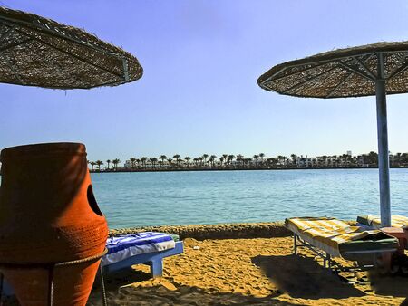 Hurghad, Egypt, - January 5, 2010: Zahabia Hotel & Beach Resort Beach Tourists Group in Hurghada, view on Arabella Azur Resort, Egypt.のeditorial素材