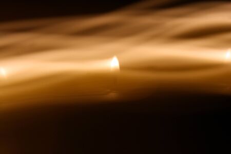 Abstract candle light looking like wavy backgroundの写真素材
