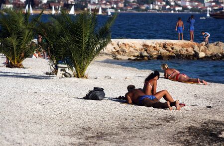 People resting on the beach in Croatia.の写真素材