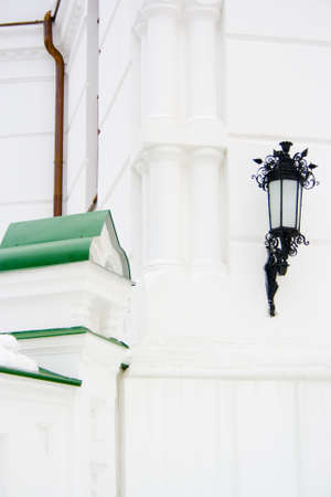 Wrought lantern on the great house wall. のeditorial素材