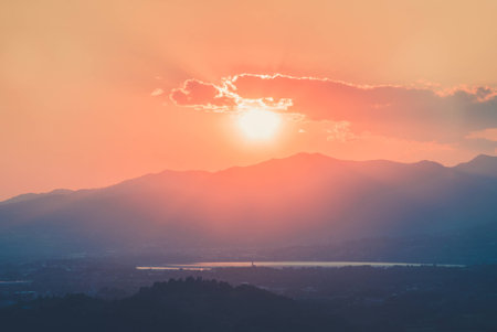Sun goes down behind the mountains