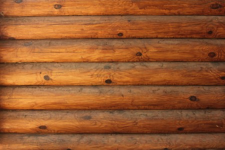 Wooden wall of Russian log house for backgroundの写真素材