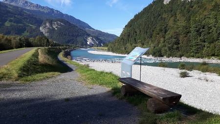 wooden chairs along Rhine river in Mels Switzerlandの写真素材