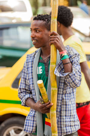 Addis Ababa, Ethiopia, January 27, 2014, Man selling sugarcane on the street