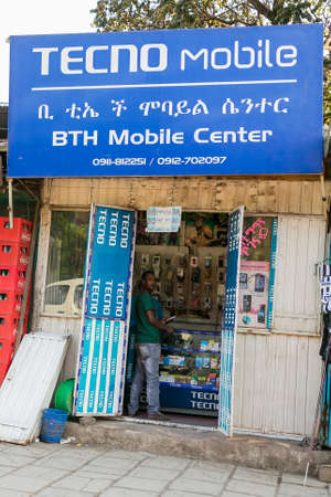 Addis Ababa, Ethiopia, January 30, 2014, Man in a small mobile phone shopのeditorial素材