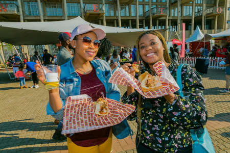Soweto, South Africa - September 8, 2018: Diverse African people at a bread based street food outdoor festivalのeditorial素材