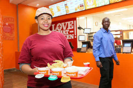 Johannesburg, South Africa - July 06 2017: Staff at a Popeyes Take Out Fast Food Restaurantのeditorial素材