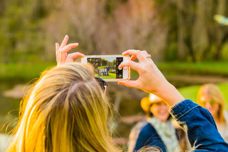 Johannesburg, South Africa - May 12 2018: Girl taking a selfie photo at food and wine festivalのeditorial素材