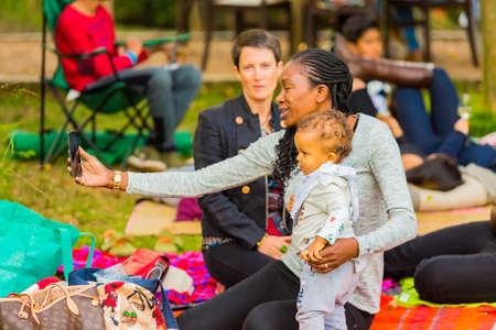 Johannesburg, South Africa - May 12 2018: Mom taking a selfie photo at food and wine festivalのeditorial素材