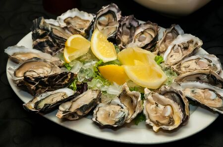 Fresh Seafood Oysters and Lemon on ice for catering at Corporate gala dinner banquet eventの写真素材