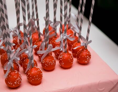 Small red Strawberry lollipops for catering at gala dinner banquet event
