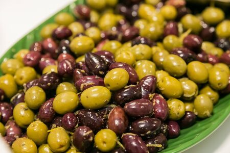 Large bowl of fresh olives for catering at a corporate event gala dinner banquetの写真素材