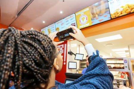 Johannesburg, South Africa - July 06 2017: Customer at a Popeyes Take Out Fast Food Restaurant